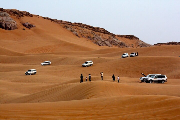 Experience the thrill of the desert with dune bashing sand boarding and unforgettable camel rides while surrounded by stunning golden sands and picturesque landscapes in Dubai.